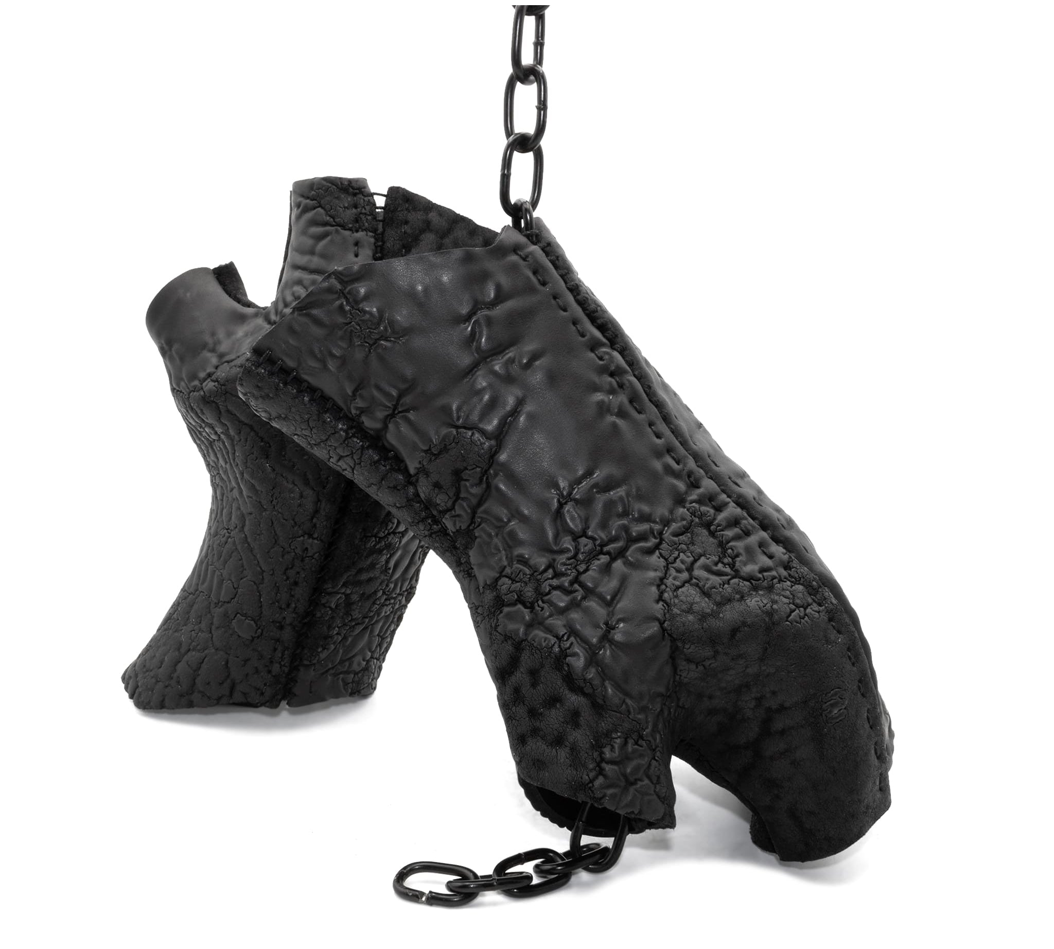 hand stitched over a 35hr period the washed reverse culatta gloves feature an open seam panel construction, a distressed black dye treatment and japanese linen thread for the stitching. the gloves are wet moulded on the body and available to buy online from avant garde leather studio atelierskn.com 