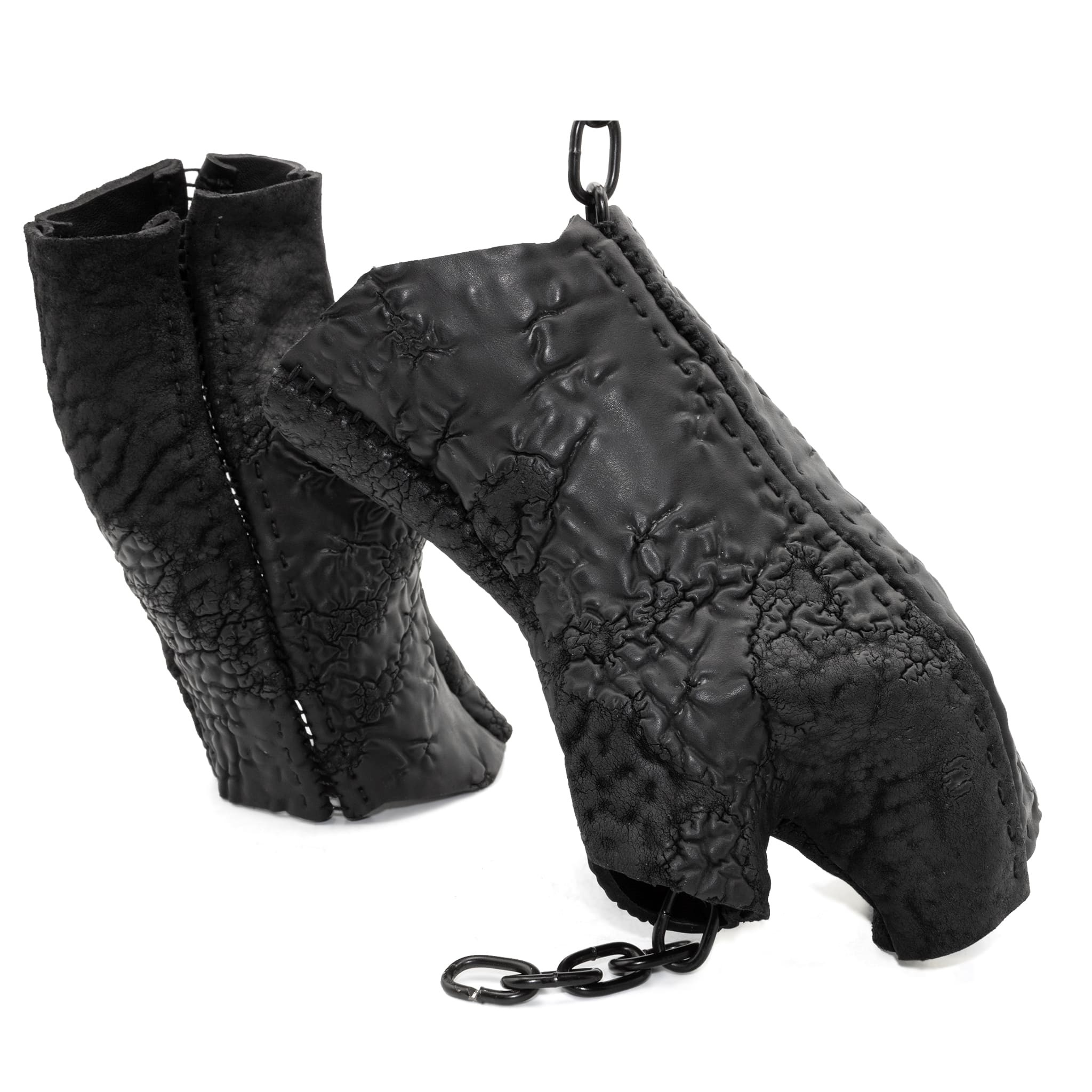 hand stitched over a 35hr period the washed reverse culatta gloves feature an open seam panel construction, a distressed black dye treatment and japanese linen thread for the stitching. the gloves are wet moulded on the body and available to buy online from avant garde leather studio atelierskn.com 