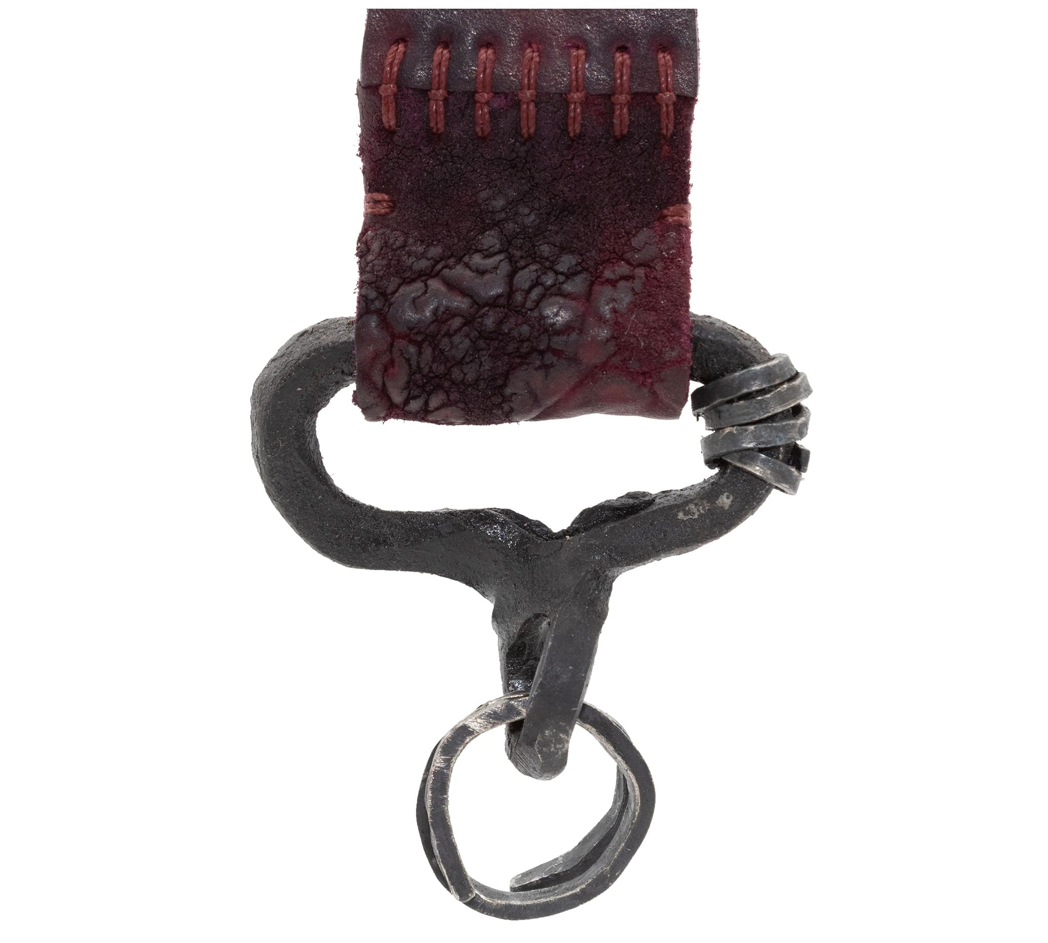 hand stitched and hand dyed horse culatta leather keychain adorned with hand forgediron and .925 sterling silver hardware. Sitting alongside a distressed swivel clip available online from artisanal leather studio atelier skn.