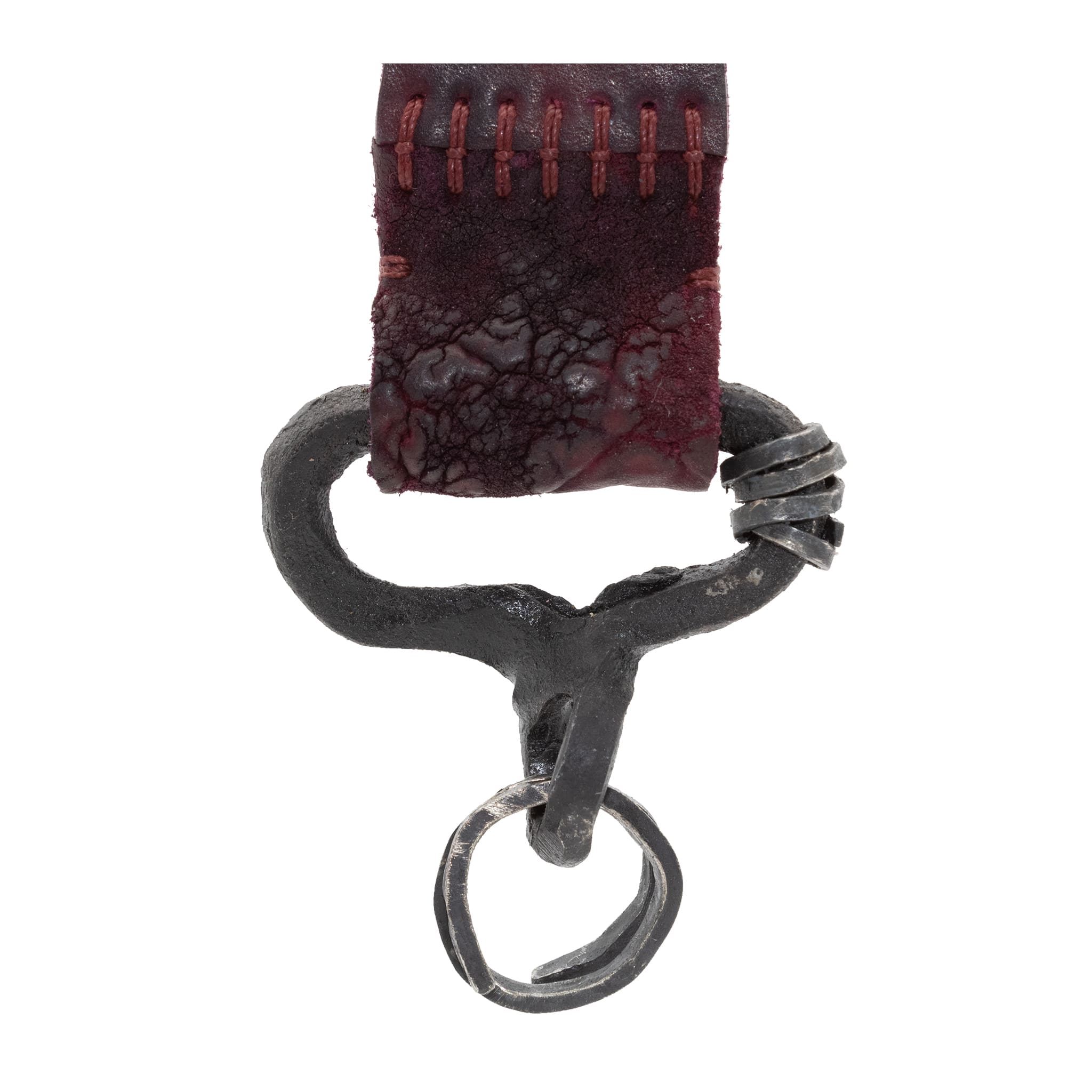 hand stitched and hand dyed horse culatta leather keychain adorned with hand forgediron and .925 sterling silver hardware. Sitting alongside a distressed swivel clip available online from artisanal leather studio atelier skn.