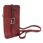 avant garde hand stitched culatta horse leather phone case, with a blood red dye finish. the phone case features a minimal silhouette with tonal japanese linen stitching and hand forged .925 sterling silver hardware. the phone holder is available to buy online from artisanal designer atelierskn.com 