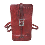 avant garde hand stitched culatta horse leather phone case, with a blood red dye finish. the phone case features a minimal silhouette with tonal japanese linen stitching and hand forged .925 sterling silver hardware. the phone holder is available to buy online from artisanal designer atelierskn.com 