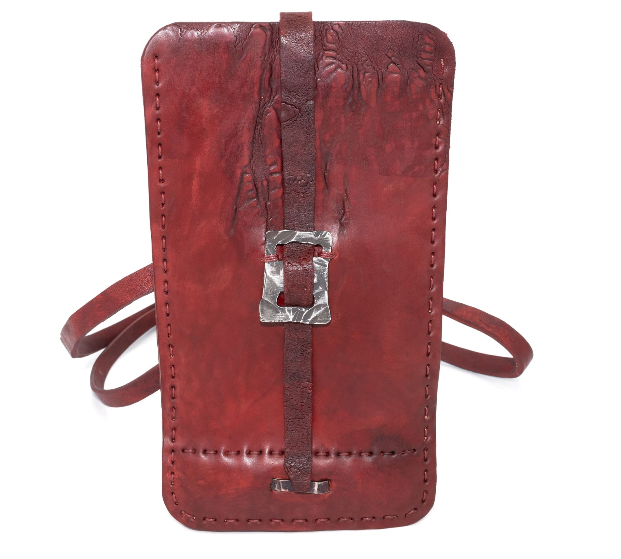avant garde hand stitched culatta horse leather phone case, with a blood red dye finish. the phone case features a minimal silhouette with tonal japanese linen stitching and hand forged .925 sterling silver hardware. the phone holder is available to buy online from artisanal designer atelierskn.com 