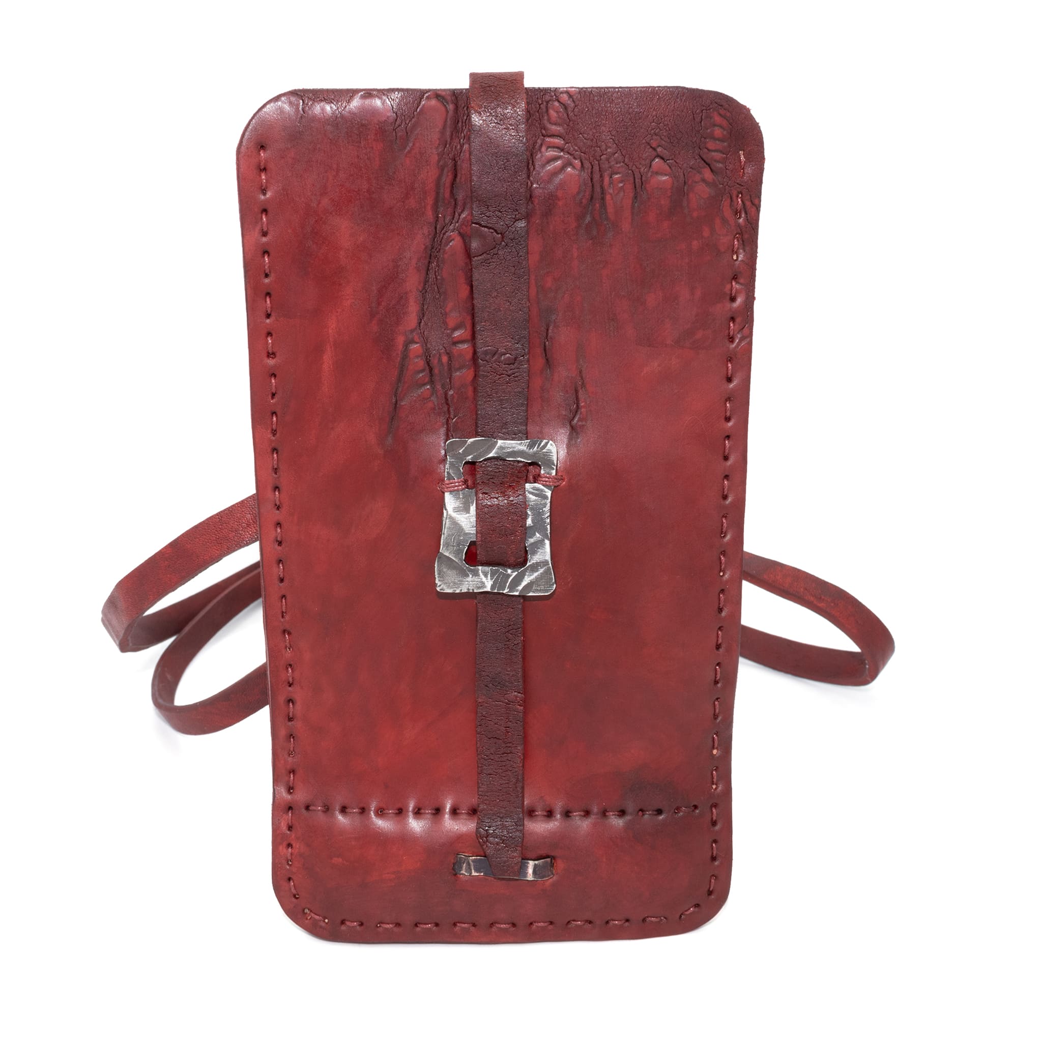 avant garde hand stitched culatta horse leather phone case, with a blood red dye finish. the phone case features a minimal silhouette with tonal japanese linen stitching and hand forged .925 sterling silver hardware. the phone holder is available to buy online from artisanal designer atelierskn.com 