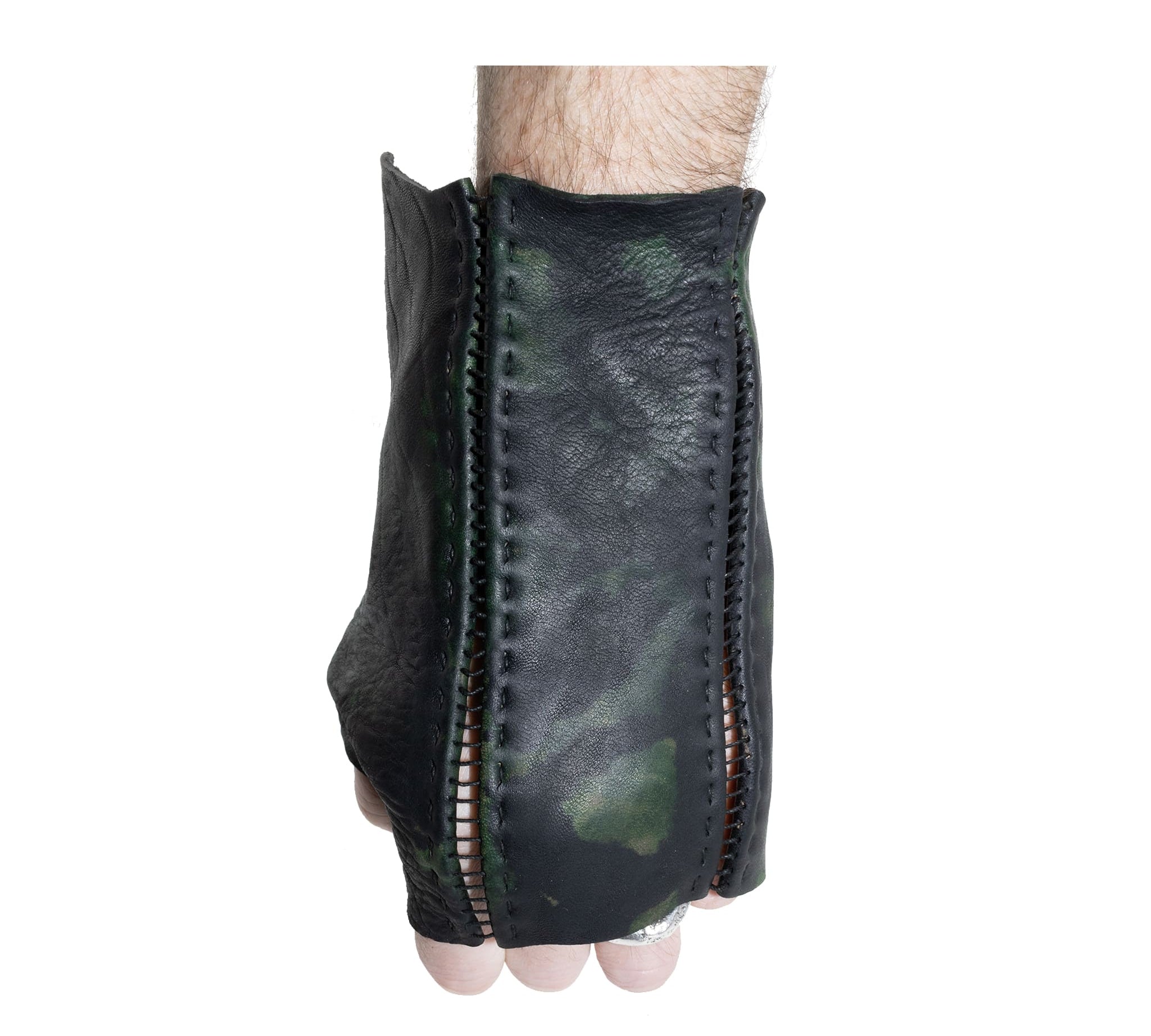 hand stitched over a 35hr period the washed horse culatta leather gloves feature deconstructed open seam panels, and a multiple layer absinthe dye treatment. the gloves are available to buy online from avant garde leather studio atelierskn.com