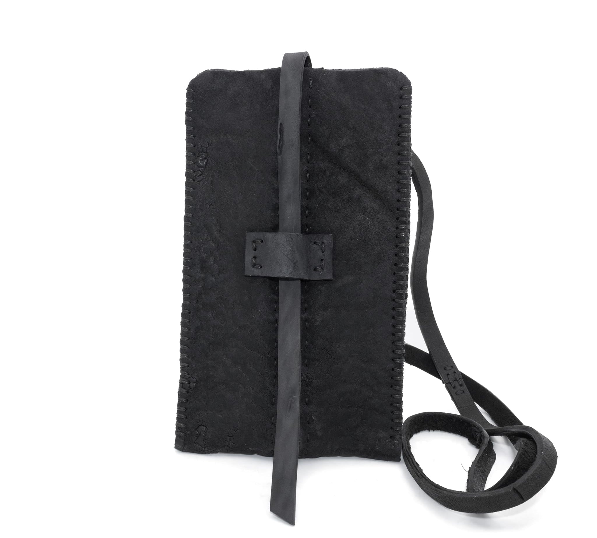 meticulously hand stitched, the washed reverse horse culatta leather phone case features a minimal silhouette with an open seam construction through the center and scar stitched sides. the bag features a distressed iron dye treatment, tonal linen stitching and a single card slot to the rear. the phone holder is available to buy online from avant garde designer atelierskn.com 