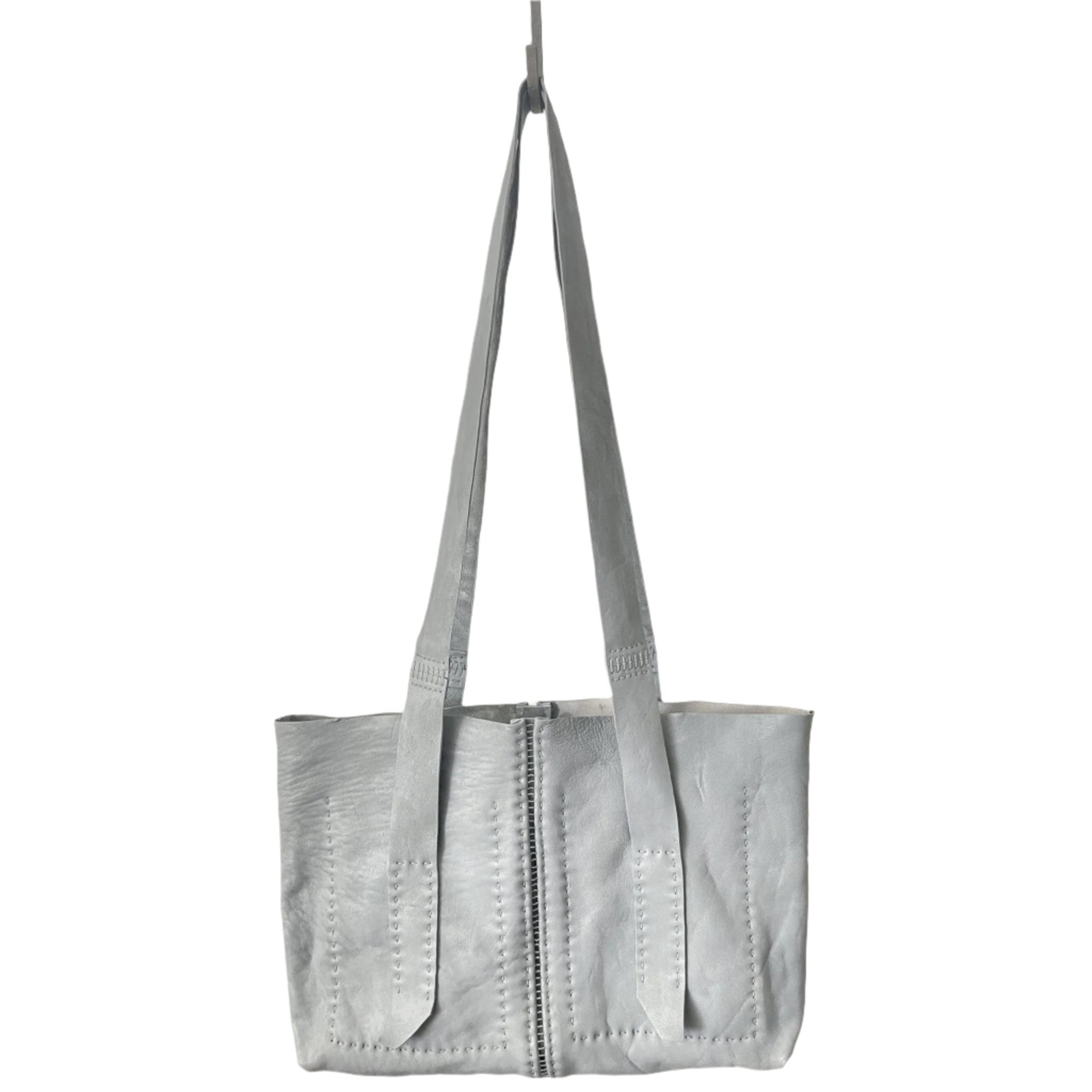 object dyed light grey horse culatta leather city shopper bag entirely hand stitched with an open seam construction and multiple interior pockets from uk based leather studio atelier skn.