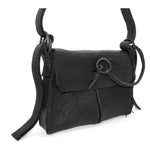 medium sized hand stitched washed horse culatta leather shoulder bag with an object dyed matte black finish. the bag features an open seam construction with a flap closure, riri zipper fastening and hand forged iron and silver hardware. the black leather bag is finished with an adjustable leather strap and is available to buy online from avant garde leather studio atelierskn.com.