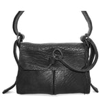 medium sized hand stitched washed horse culatta leather shoulder bag with an object dyed matte black finish. the bag features an open seam construction with a flap closure, riri zipper fastening and hand forged iron and silver hardware. the black leather bag is finished with an adjustable leather strap and is available to buy online from avant garde leather studio atelierskn.com.