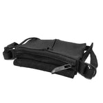 medium sized hand stitched washed horse culatta leather shoulder bag with an object dyed matte black finish. the bag features an open seam construction with a flap closure, riri zipper fastening and hand forged iron and silver hardware. the black leather bag is finished with an adjustable leather strap and is available to buy online from avant garde leather studio atelierskn.com.