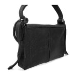 medium sized hand stitched washed horse culatta leather shoulder bag with an object dyed matte black finish. the bag features an open seam construction with a flap closure, riri zipper fastening and hand forged iron and silver hardware. the black leather bag is finished with an adjustable leather strap and is available to buy online from avant garde leather studio atelierskn.com.