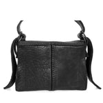 medium sized hand stitched washed horse culatta leather shoulder bag with an object dyed matte black finish. the bag features an open seam construction with a flap closure, riri zipper fastening and hand forged iron and silver hardware. the black leather bag is finished with an adjustable leather strap and is available to buy online from avant garde leather studio atelierskn.com.