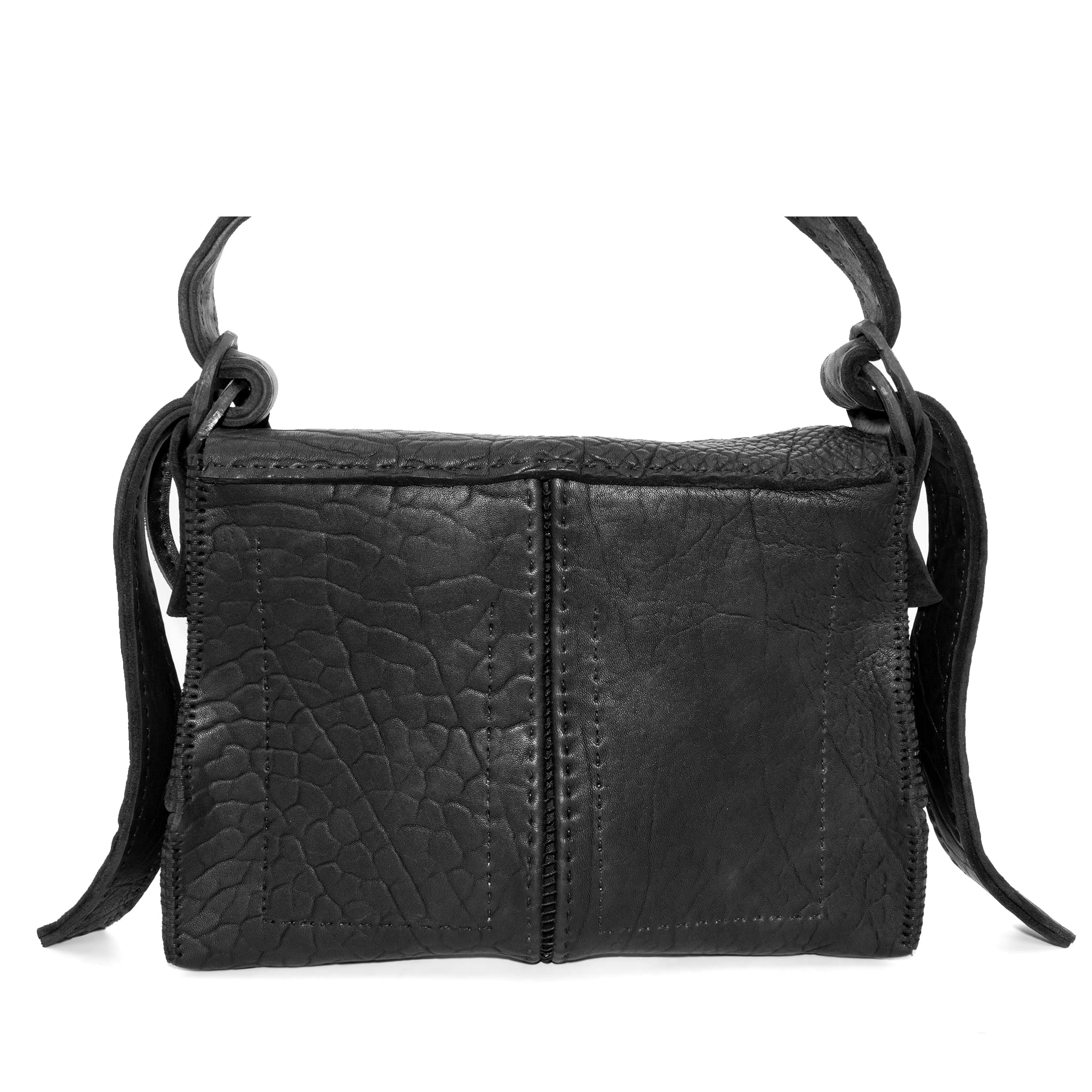 medium sized hand stitched washed horse culatta leather shoulder bag with an object dyed matte black finish. the bag features an open seam construction with a flap closure, riri zipper fastening and hand forged iron and silver hardware. the black leather bag is finished with an adjustable leather strap and is available to buy online from avant garde leather studio atelierskn.com.