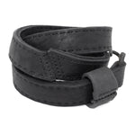 avant garde hand stitched horse culatta leather hook belt, with an iron dye finish. the belt features a minimal deconstructed silhouette with tonal japanese linen stitching and hand forged iron hook fastening. available to buy online from artisanal designer atelierskn.com 