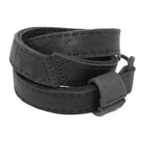 avant garde hand stitched horse culatta leather hook belt, with an iron dye finish. the belt features a minimal deconstructed silhouette with tonal japanese linen stitching and hand forged iron hook fastening. available to buy online from artisanal designer atelierskn.com 