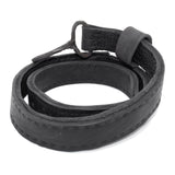 avant garde hand stitched horse culatta leather hook belt, with an iron dye finish. the belt features a minimal deconstructed silhouette with tonal japanese linen stitching and hand forged iron hook fastening. available to buy online from artisanal designer atelierskn.com 