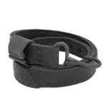 avant garde hand stitched horse culatta leather hook belt, with an iron dye finish. the belt features a minimal deconstructed silhouette with tonal japanese linen stitching and hand forged iron hook fastening. available to buy online from artisanal designer atelierskn.com 