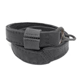 avant garde hand stitched horse culatta leather hook belt, with an iron dye finish. the belt features a minimal deconstructed silhouette with tonal japanese linen stitching and hand forged iron hook fastening. available to buy online from artisanal designer atelierskn.com 