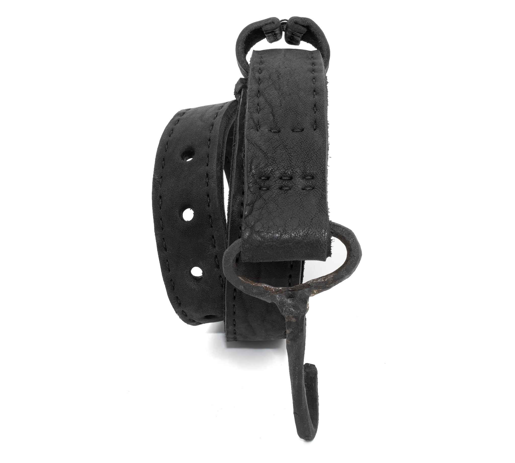 avant garde hand stitched horse culatta leather hook belt, with an iron dye finish. the belt features a minimal deconstructed silhouette with tonal japanese linen stitching and hand forged iron hook fastening. available to buy online from artisanal designer atelierskn.com 