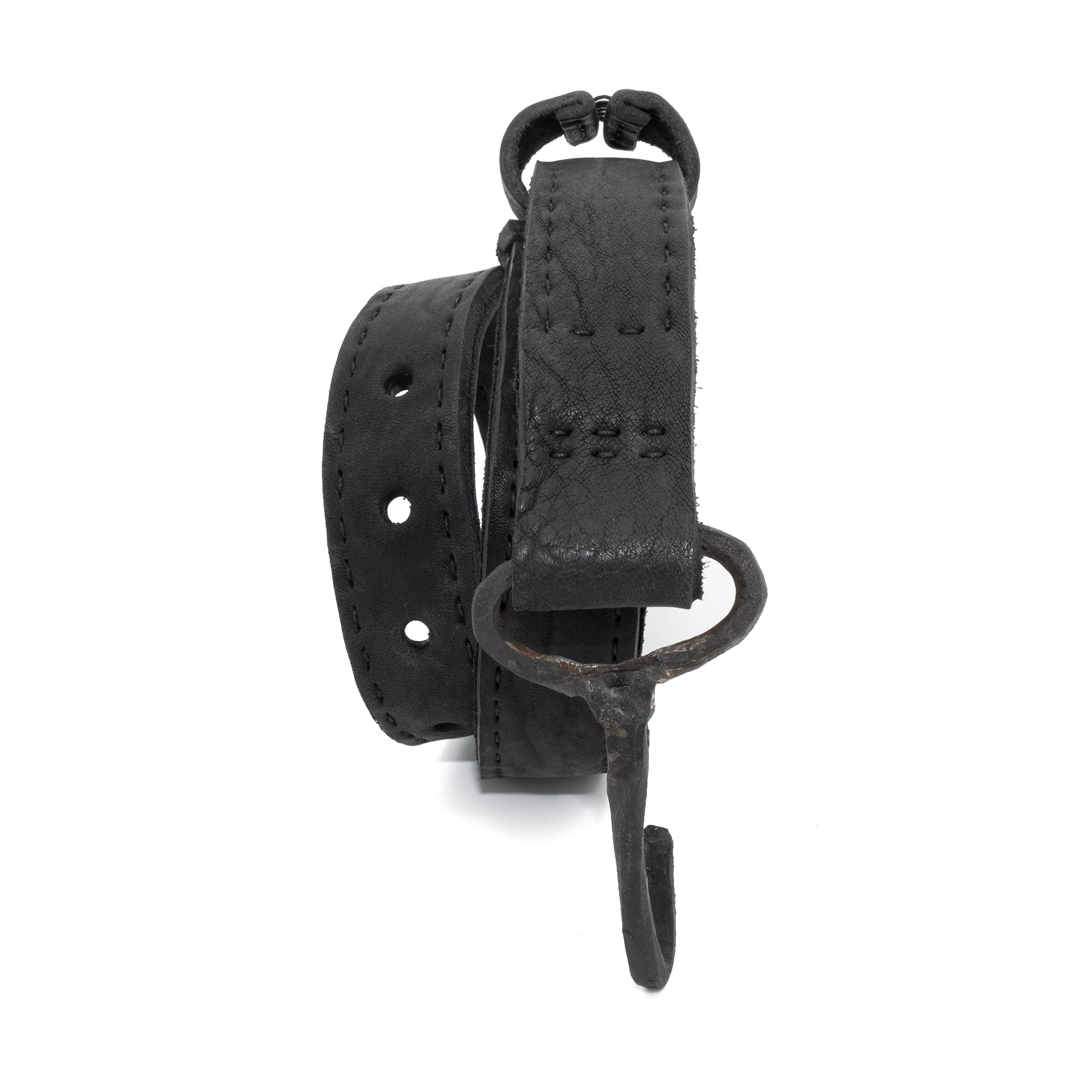 avant garde hand stitched horse culatta leather hook belt, with an iron dye finish. the belt features a minimal deconstructed silhouette with tonal japanese linen stitching and hand forged iron hook fastening. available to buy online from artisanal designer atelierskn.com 