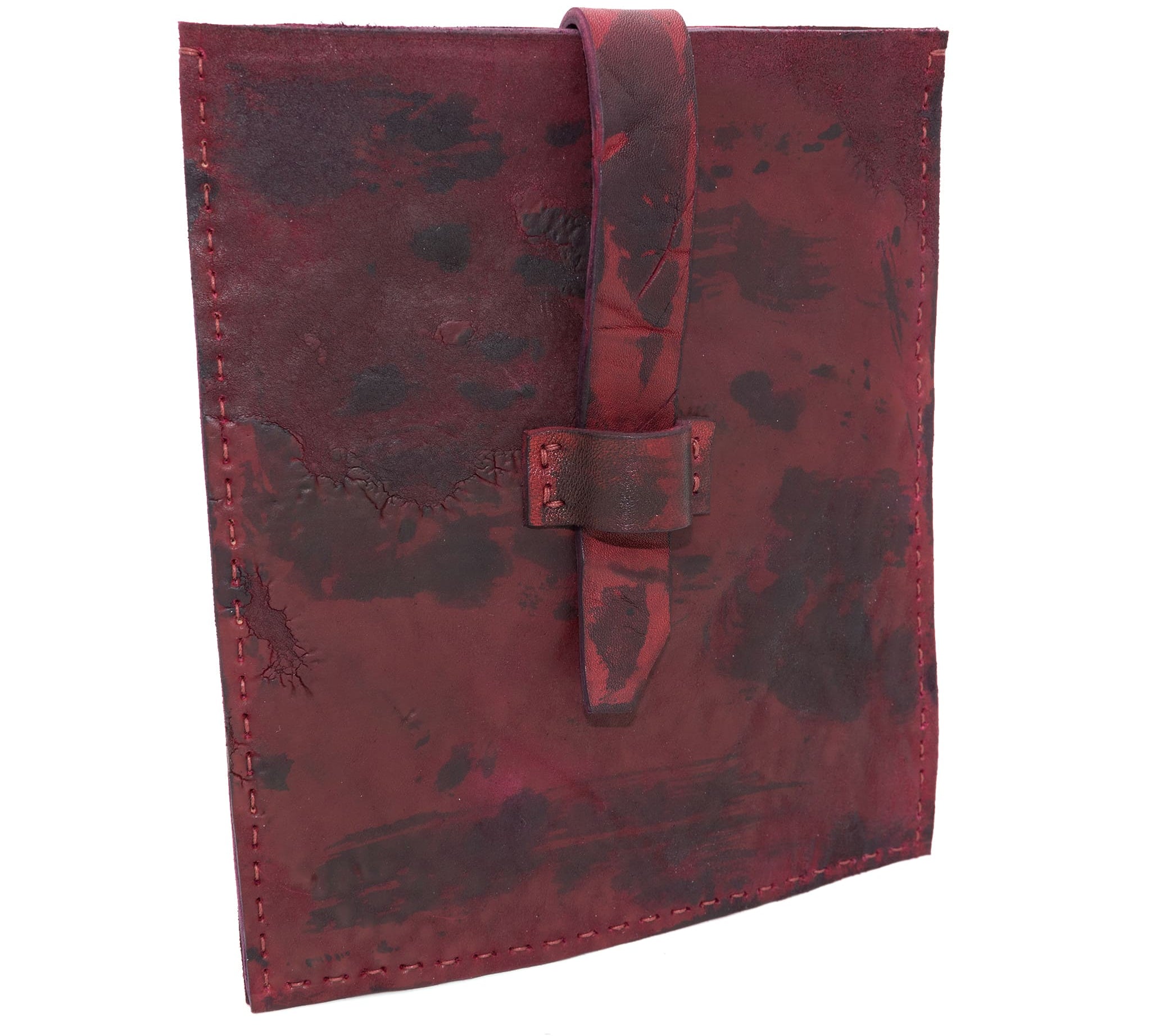 hand dyed blood red horse leather ebook pochette with a strap closure and hand stitched available to buy online at atelierskn.com