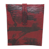 hand dyed blood red horse leather ebook pochette with a strap closure and hand stitched available to buy online at atelierskn.com