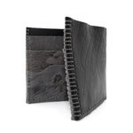 the classic wedge 6 pocket bifold wallet crafted from a supple matte black horse culatta leather with contrasting kudu leather card pockets available to buy online from artisanal leather studio atelierskn.com