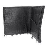 a closed seam 4 pocket bifold wallet crafted from a supple matte black washed horse leather with a closed seam construction. the wallet features a tonal rubber drip and is available to buy online from artisanal leather studio atelierskn.com