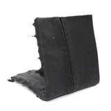 a closed seam 4 pocket bifold wallet crafted from a supple matte black washed horse leather with a closed seam construction. the wallet features a tonal rubber drip and is available to buy online from artisanal leather studio atelierskn.com
