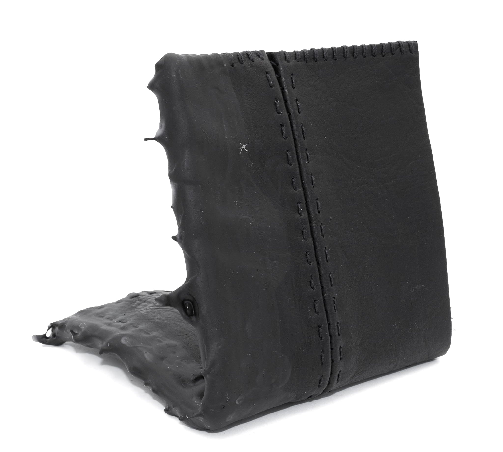 a closed seam 4 pocket bifold wallet crafted from a supple matte black washed horse leather with a closed seam construction. the wallet features a tonal rubber drip and is available to buy online from artisanal leather studio atelierskn.com