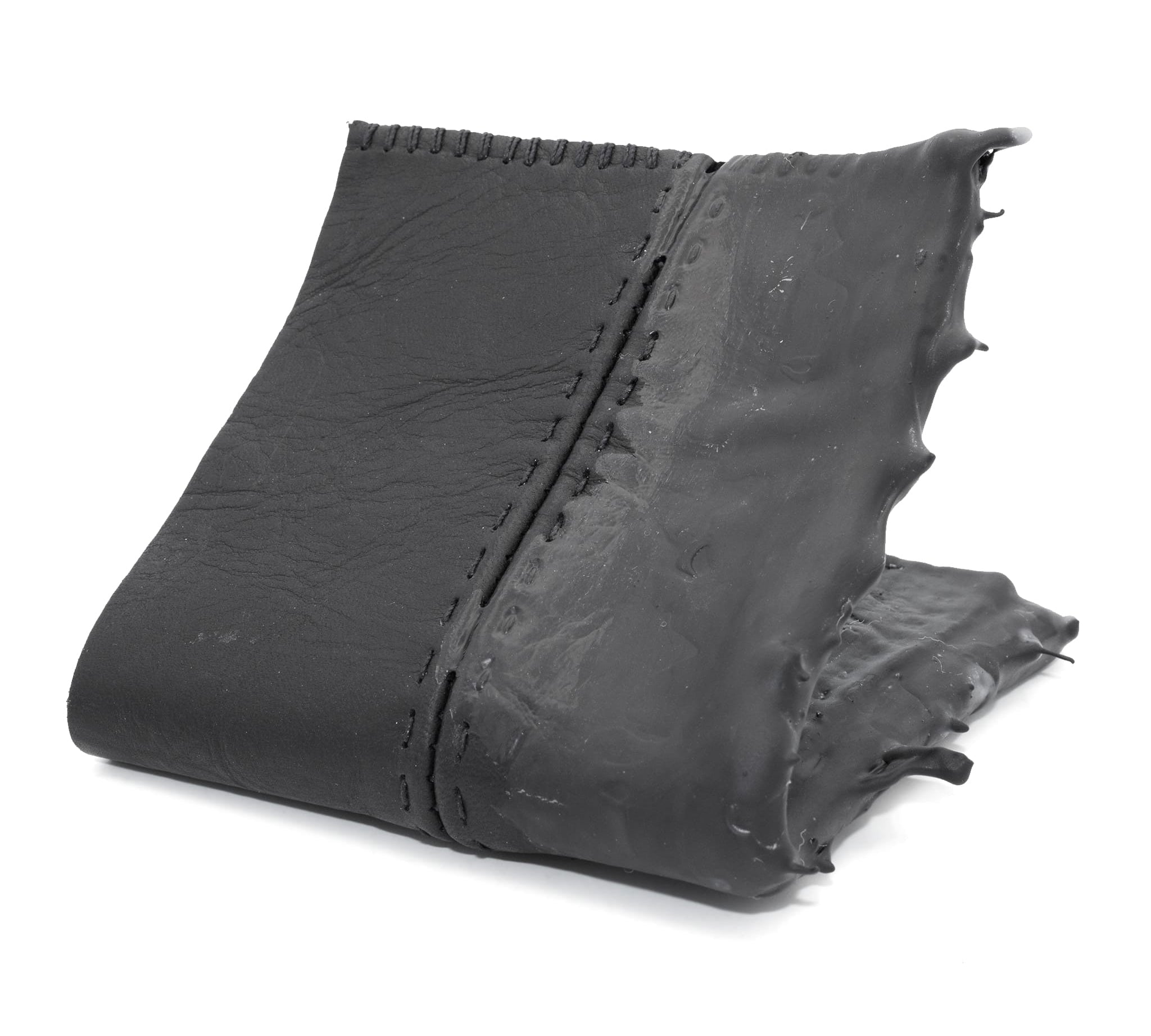 a closed seam 4 pocket bifold wallet crafted from a supple matte black washed horse leather with a closed seam construction. the wallet features a tonal rubber drip and is available to buy online from artisanal leather studio atelierskn.com