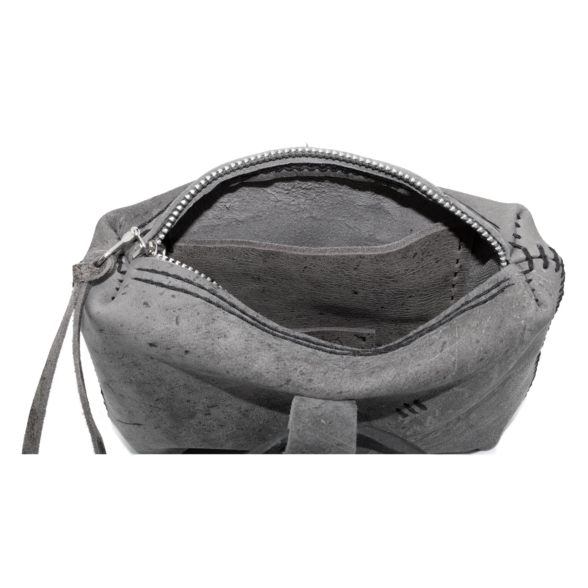 meticulously hand stitched kudu leather bag with a zipper fastening and large iron ring carry handle. an adjustable double layered shoulder strap is adorned with a distressed clip. the bag is available to buy online from uk based avant garde leather studio telierskn.com