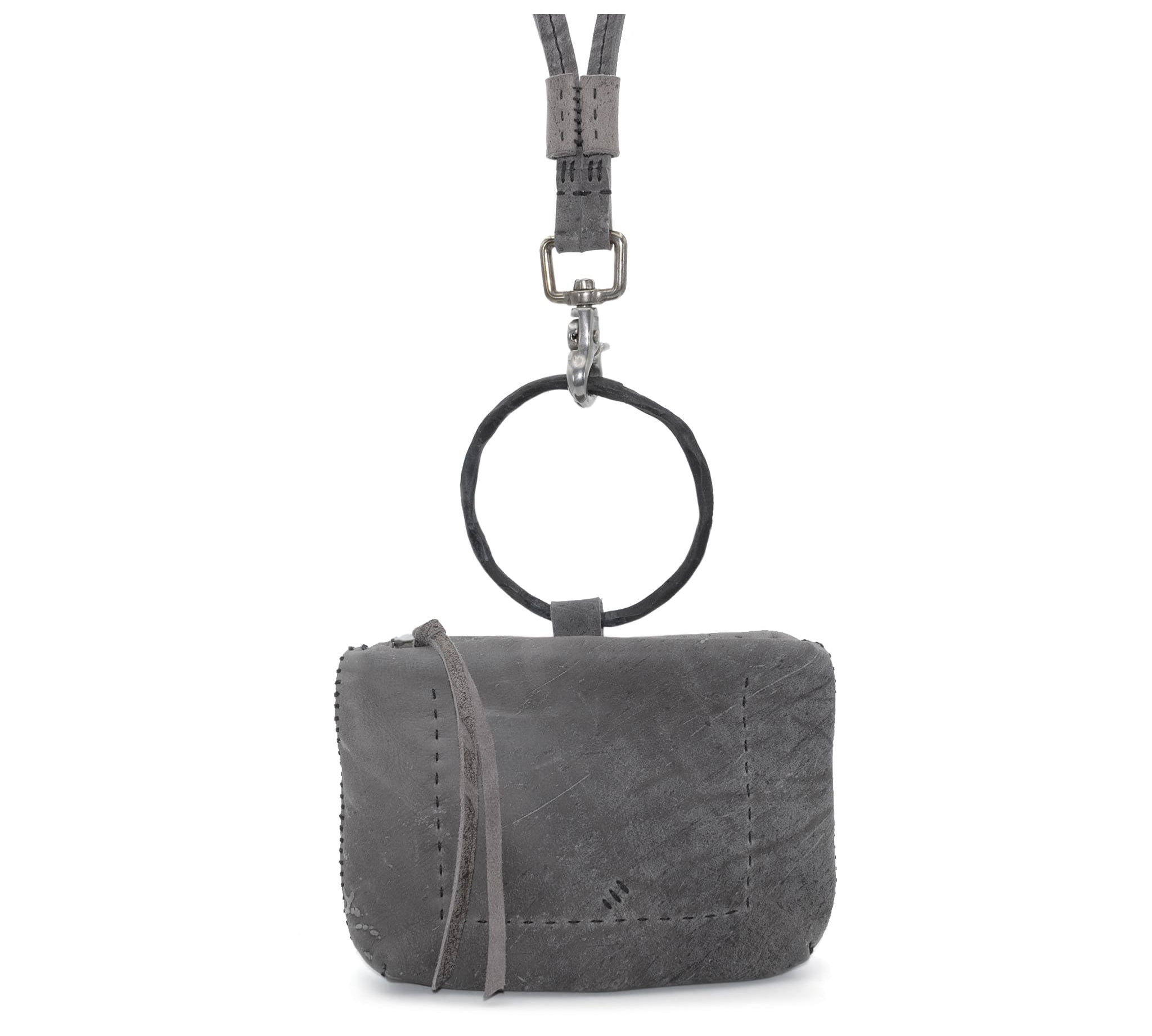 meticulously hand stitched kudu leather bag with a zipper fastening and large iron ring carry handle. an adjustable double layered shoulder strap is adorned with a distressed clip. the bag is available to buy online from uk based avant garde leather studio telierskn.com