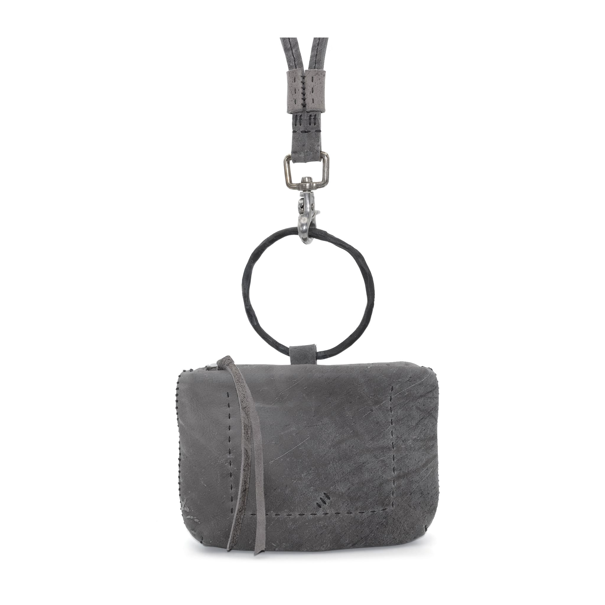 meticulously hand stitched kudu leather bag with a zipper fastening and large iron ring carry handle. an adjustable double layered shoulder strap is adorned with a distressed clip. the bag is available to buy online from uk based avant garde leather studio telierskn.com