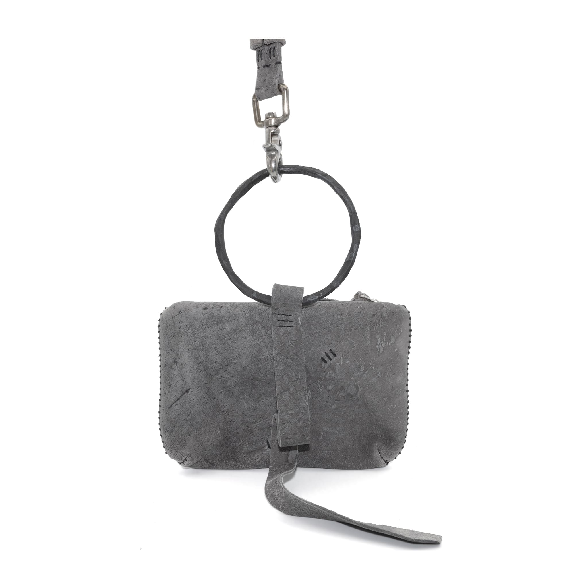 meticulously hand stitched kudu leather bag with a zipper fastening and large iron ring carry handle. an adjustable double layered shoulder strap is adorned with a distressed clip. the bag is available to buy online from uk based avant garde leather studio telierskn.com