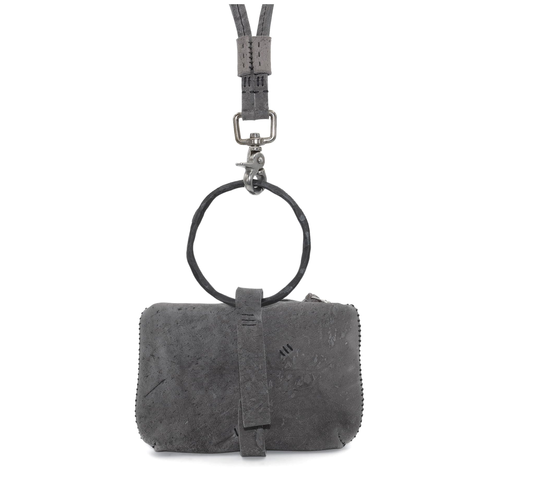 meticulously hand stitched kudu leather bag with a zipper fastening and large iron ring carry handle. an adjustable double layered shoulder strap is adorned with a distressed clip. the bag is available to buy online from uk based avant garde leather studio telierskn.com