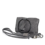 meticulously hand stitched kudu leather bag with a zipper fastening and large iron ring carry handle. an adjustable double layered shoulder strap is adorned with a distressed clip. the bag is available to buy online from uk based avant garde leather studio telierskn.com