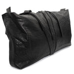 hand stitched washed horse culatta leather bag with a matte black finish. the bag features an open seam construction, riri zipper closure and hand forged iron and silver hardware available to buy online from artisanal leather studio atelierskn.com.