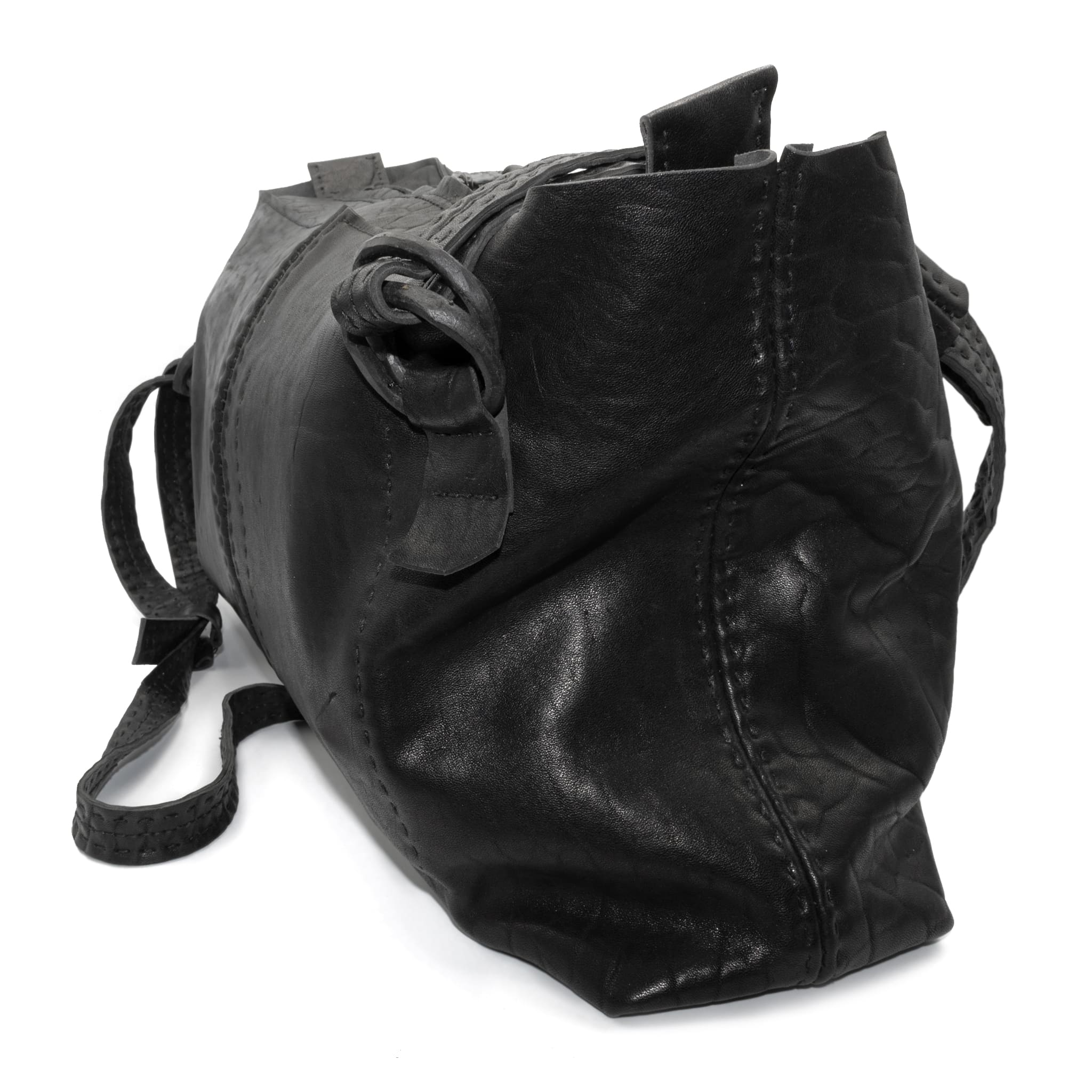 hand stitched washed horse culatta leather bag with a matte black finish. the bag features an open seam construction, riri zipper closure and hand forged iron and silver hardware available to buy online from artisanal leather studio atelierskn.com.