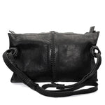 hand stitched washed horse culatta leather bag with a matte black finish. the bag features an open seam construction, riri zipper closure and hand forged iron and silver hardware available to buy online from artisanal leather studio atelierskn.com.