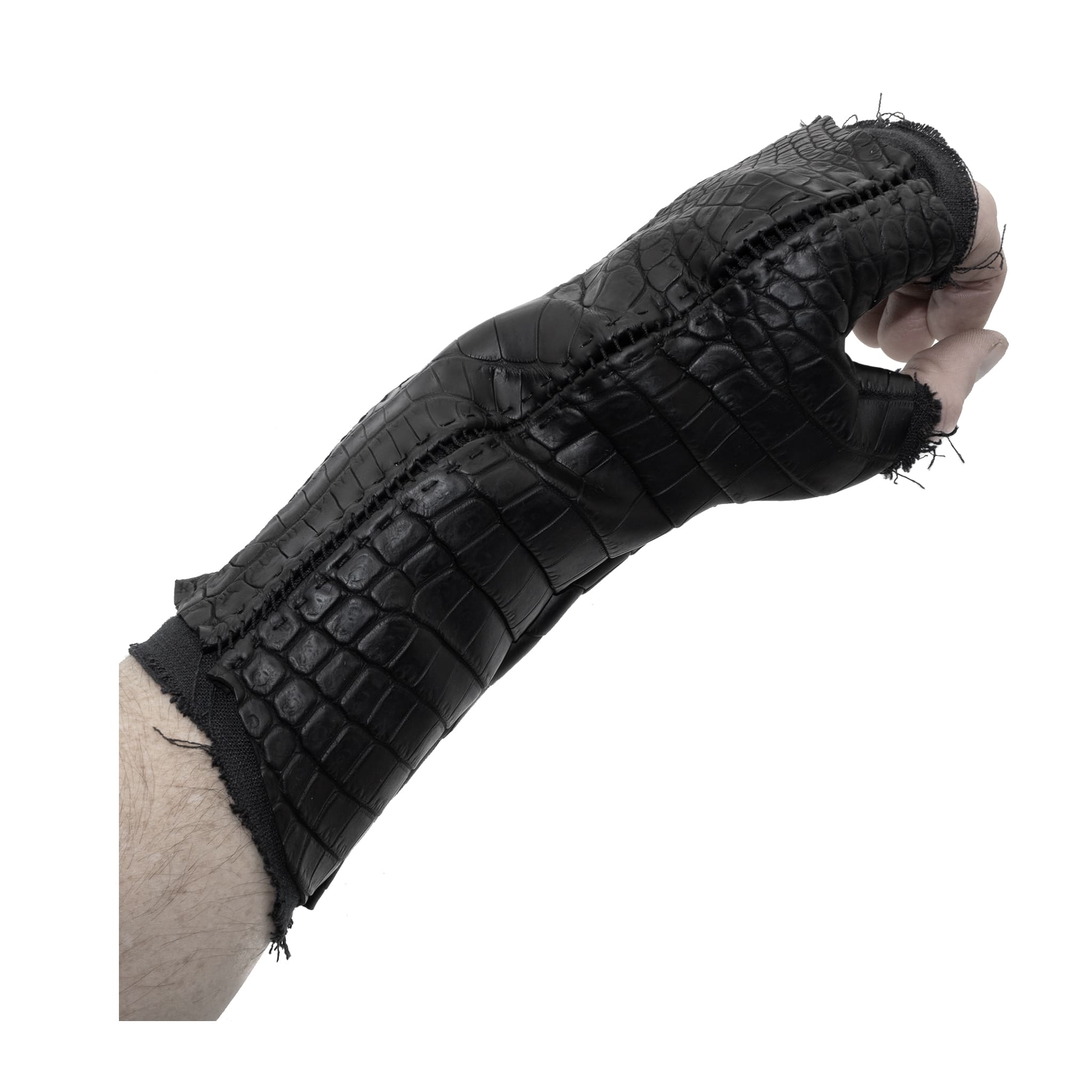 hand stitched over a 40hr period the genuine crocodile leather gloves feature deconstructed open seam panels, and a raw cut stone washed ramie lining. with an object dyed finish the gloves are then wet moulded on the body over an 8 hour period for a sculptured aesthetic. the gloves are available to buy online from avant garde leather studio atelierskn.com