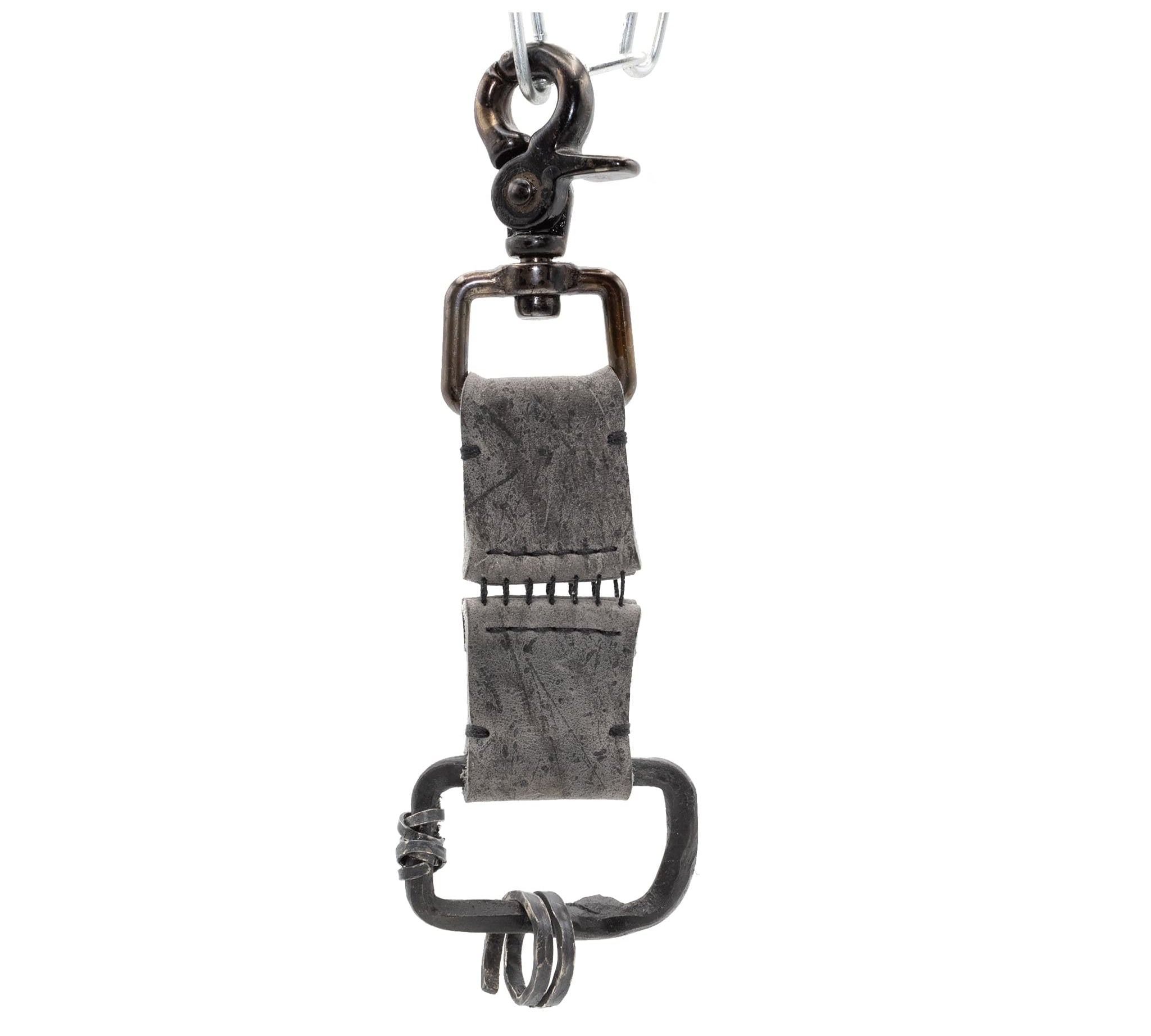 the hand sewn kudu leather keychain features a soft grey dye treatment and a distressed lobster swivel clip. a hand forged black iron ring holds the oxidised .925 silver key ring. Buy online from avant garde leather studio atelier skn.