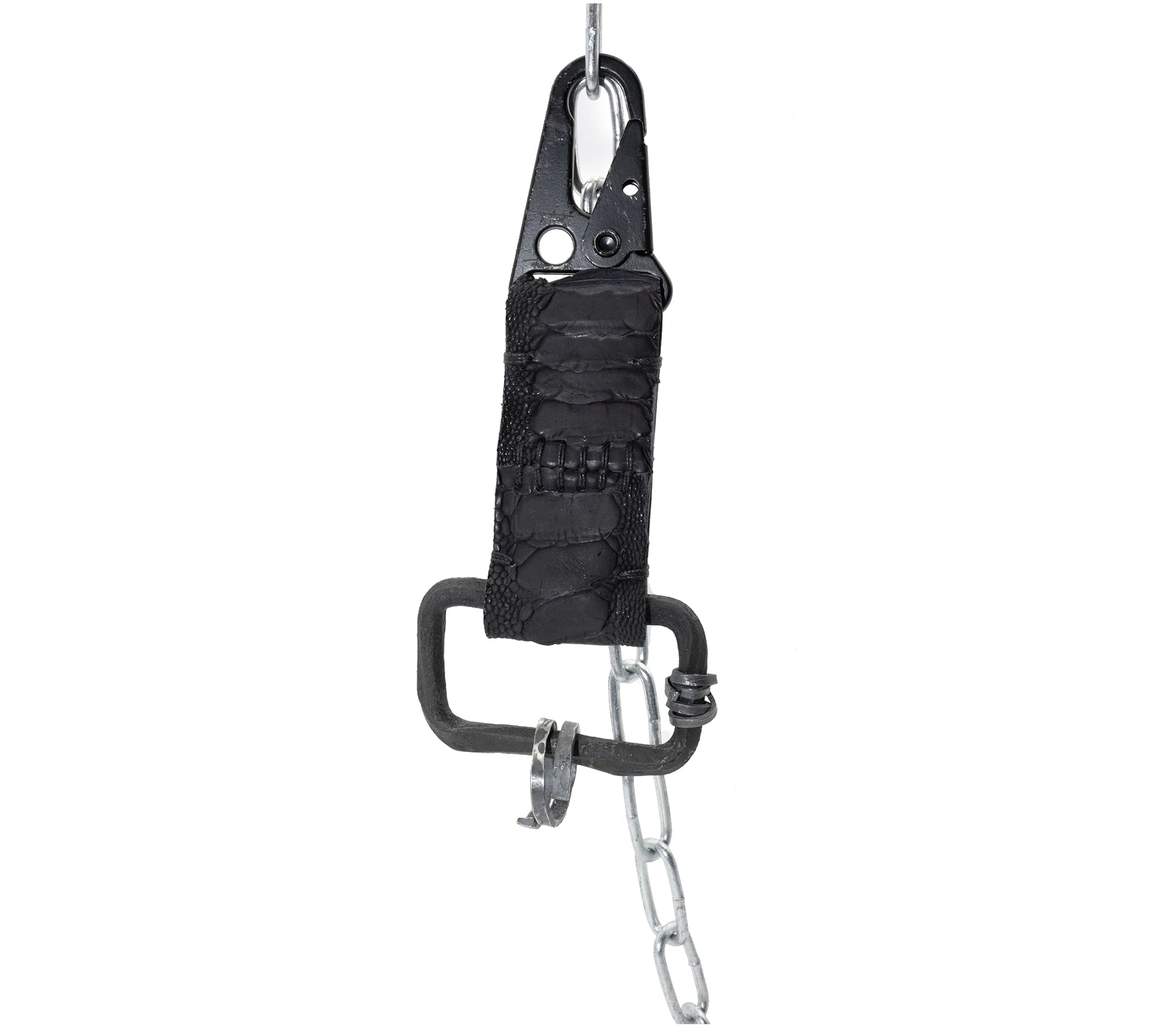 the hand sewn ostrich leather keychain features a flat matte black dye treatment and a distressed military sling clip. a hand forged black iron ring holds the oxidised .925 silver key ring. Buy online from avant garde leather studio atelier skn.