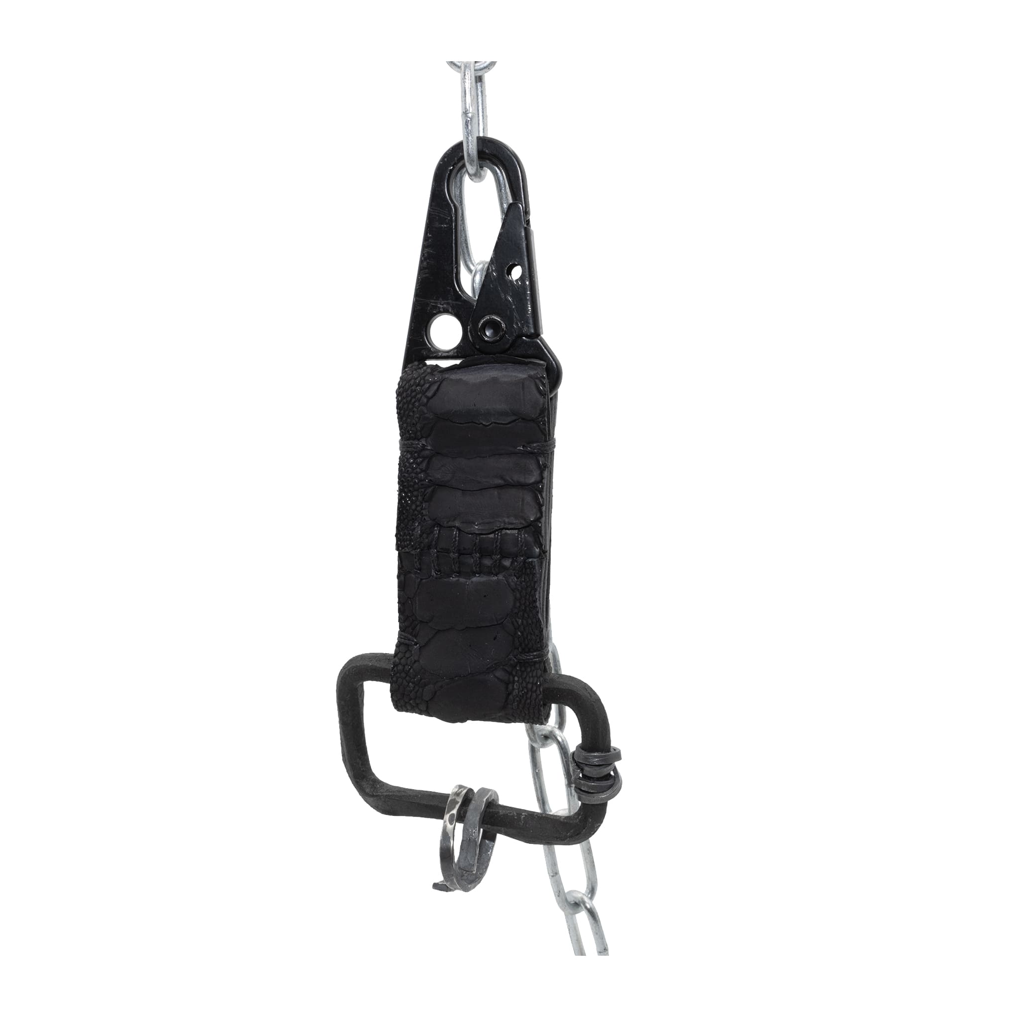 the hand sewn ostrich leather keychain features a flat matte black dye treatment and a distressed military sling clip. a hand forged black iron ring holds the oxidised .925 silver key ring. Buy online from avant garde leather studio atelier skn.