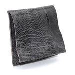 hand sewn one piece bifold wallet crafted from a 1mm distressed black ostrich leather from atelier skn