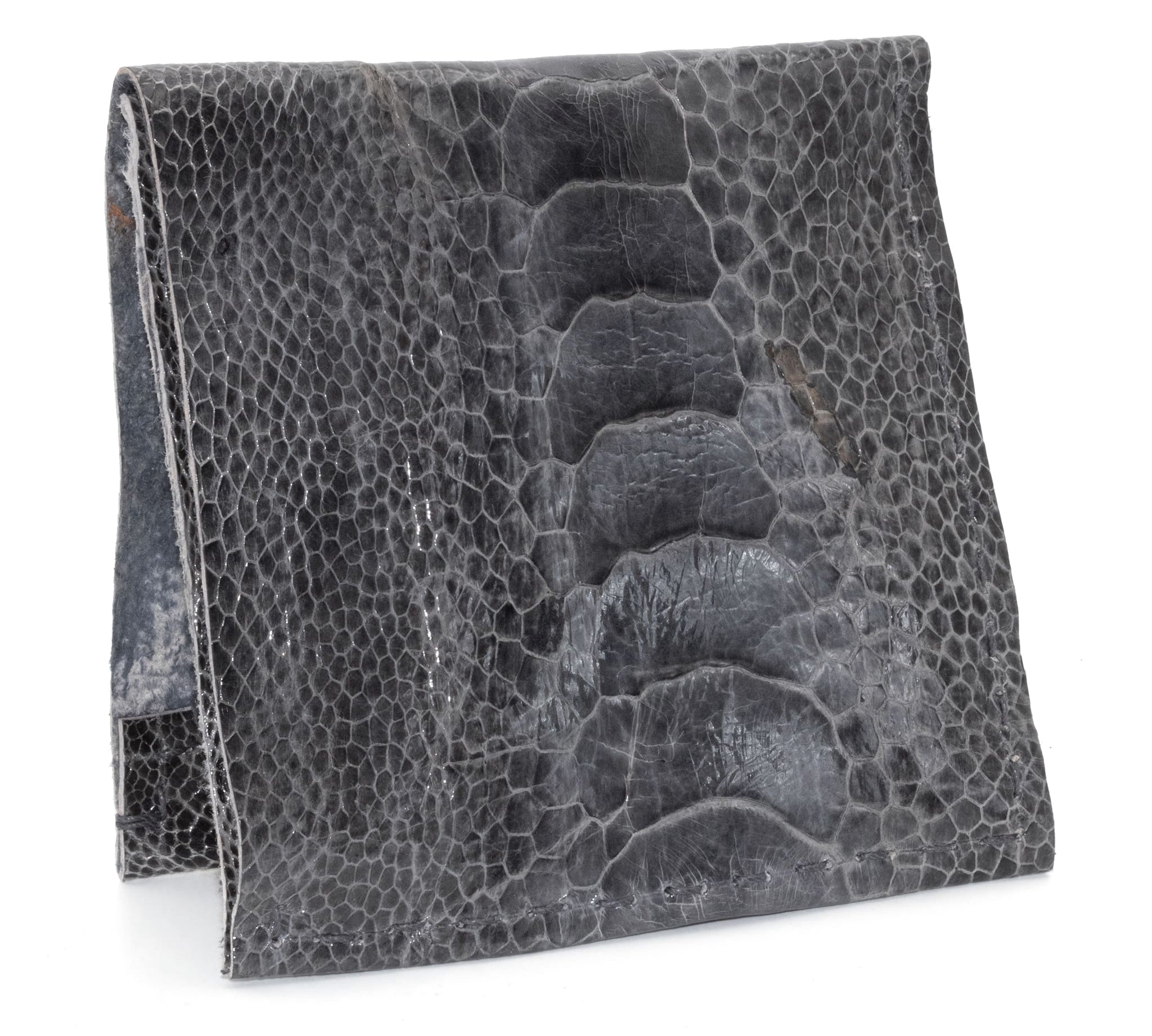 hand sewn one piece bifold wallet crafted from a 1mm distressed black ostrich leather from atelier skn
