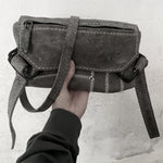 avant garde hand stitched patchwork shoulder bag in a soft kudu leather. the bag features a zipper closure, hand forged iron hardware and an adjustable shoulder strap. the bag has been hand sewn without the use of machines and is available to buy online from artisanal leather studio atelierskn.com.