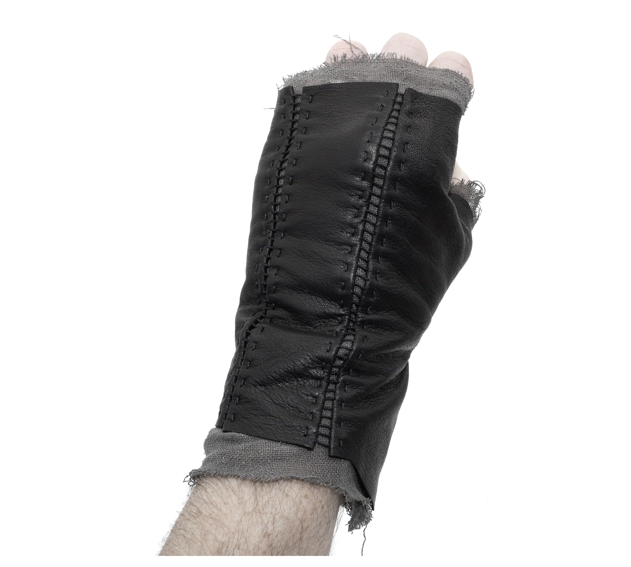 hand stitched over a 35hr period the washed kangaroo leather gloves feature deconstructed open seam panels, and an object dyed raw silk floating lining. the gloves are available to buy online from avant garde leather studio atelierskn.com