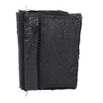 object dyed matte black reverse horse culatta leather cardholder, hand stitched over an 18 hour period without the use of machines. the leather bifold card case features multiple card slots, and a french linen lining. an open seam construction is hand stitched in a japanese linen thread. the wallet is available to buy online from avant garde leather studio atelierskn.com