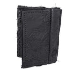 object dyed matte black reverse horse culatta leather cardholder, hand stitched over an 18 hour period without the use of machines. the leather bifold card case features multiple card slots, and a french linen lining. an open seam construction is hand stitched in a japanese linen thread. the wallet is available to buy online from avant garde leather studio atelierskn.com